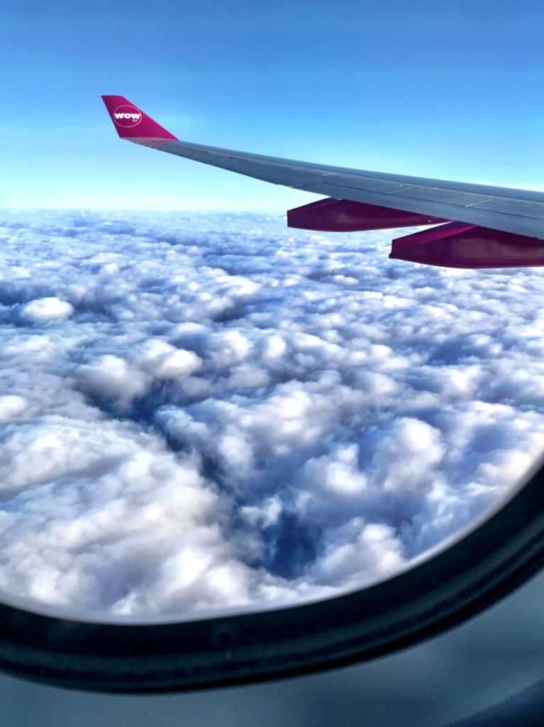 Visiting Iceland with Kids - WOW air Wing Over Clouds